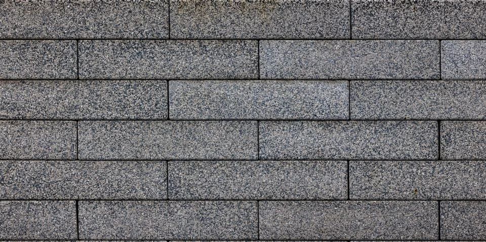 Flat texture and full-frame background of gray long rectangular brick pavement 스톡 사진