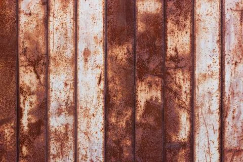 Flat texture of rusty corrugated flat thin sheet metal surface with vertical Stock Photos