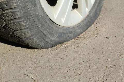 A flat tire on a car Stock Photos