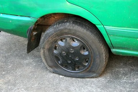 Flat tire on car Stock Photos