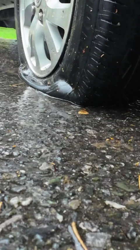 Flat Tire Of Mini Van CarOn Side Of  Road In Rainy Day. Stock Footage 275266359