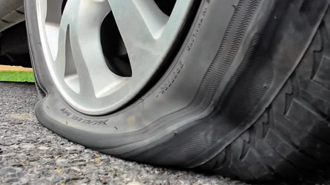 Flat Tire Of Mini Van CarOn Side Of  Road. Stock Footage 275266823