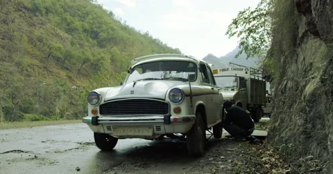 Flat tire on a narrow mountain road Stock-Footage 59980725