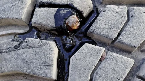 Flat Tire Screw Leak Off Road Tire Close Up. Stock Footage 333411766