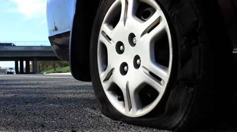 Flat Tire on Side of Freeway Stock Footage
