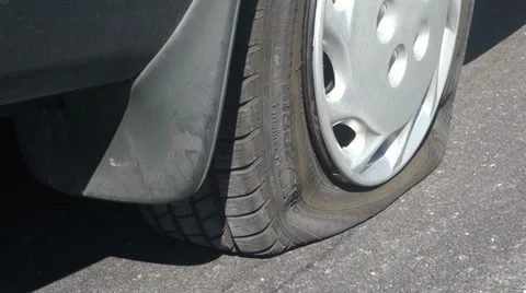 Flat tire side of road 2 Stock Footage 31579418