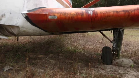 Flat Tire Of Small Abandoned Plane In Field Vídeo Stock 147005402