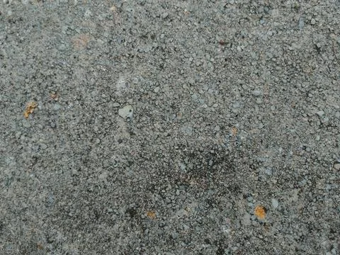 A flat top-down view of an exposed aggregate concrete surface with fine peb.. Stock Photos