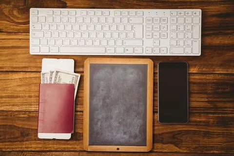 Flat top-down view showing chalkboard slate between keyboard, passport, US 写真素材