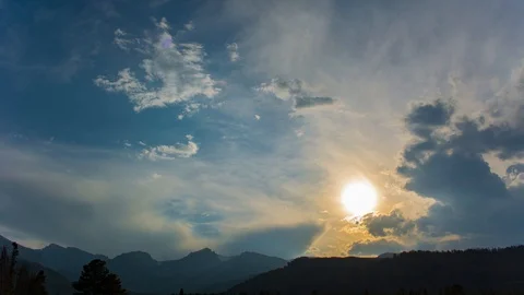 Flat Top Mountain Silhouette Sunset With Multi Directional Coluds Time Lapse, Stock Footage 128937855