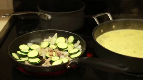 Flat top stove cooking vegetables Stock Footage 69076779