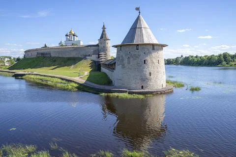 A flat tower in the Pskov Kremlin on the side of the Velikaya River. Russia Stock Photos