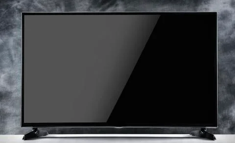 Flat tv on a dark background. Stock Photos