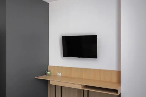 Flat TV hangs on the wall Foto stock
