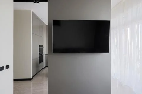 Flat TV hangs on the wall Fotos Stock