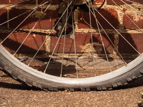 Flat tyre on bicycle Stock Photos