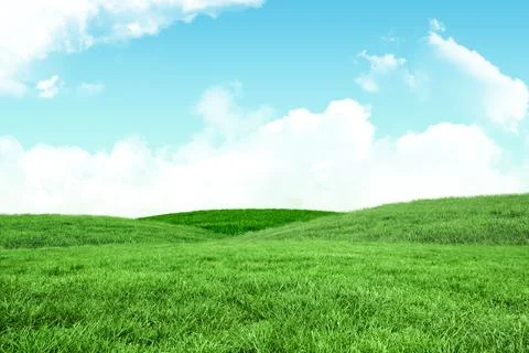 Flat vector art is showing rolling green hills and fluffy clouds under sunny Stock Photos
