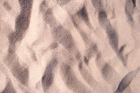 Flat view of clean yellow sand surface covering seaside beach. Sandy texture Foto stock