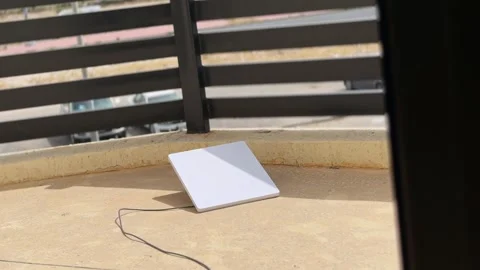 Flat White Satellite Internet Dish On Sunny Balcony Stock Footage 338426699