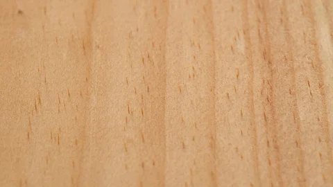Flat wooden surface tracking. Wood texture. Dolly shot. Low angle, macro. 4K Stock Footage 125906790