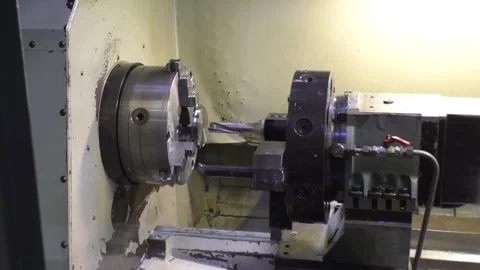 A flat workpiece stands on a white lathe Stock Footage 235307814