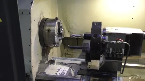 A flat workpiece stands on a white lathe Stock Footage 235307818