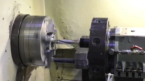 A flat workpiece stands on a white lathe Stock Footage 235307848