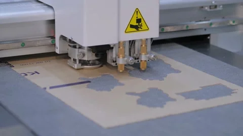 Flatbed cutter, plotter cutting cardboard sheet at printer exhibition Stock Footage 150803270