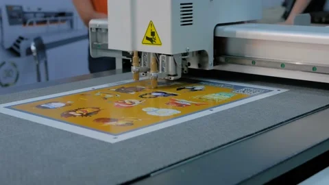 Flatbed cutter, plotter cutting label stickers at advertising exhibition Stock Footage 155530061