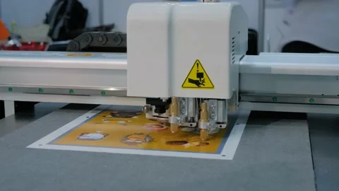 Flatbed cutter, plotter cutting label stickers at advertising exhibition Stock Footage 157419468