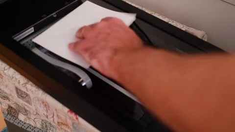 A flatbed scanner during the scanning process inside an office setting Stock Footage 292591014