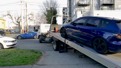 Flatbed Tow Truck Loading A Broken Vehicle - Roadside Service - wide, Stock Footage 153444143