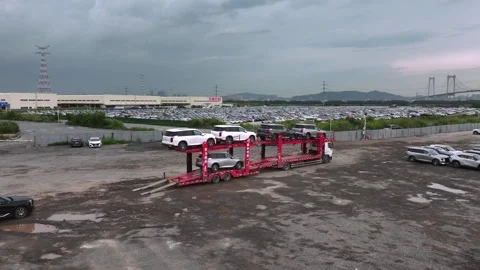 Flatbed truck, Low loader loaded new cars to transporting. Dealership sales. Video stock 327725723