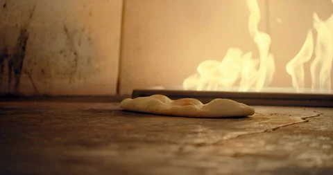 Flatbread Cooking in Fire Oven Stock-Footage 129849217