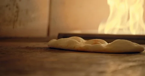 Flatbread Cooking in Fire Oven Video stock 129849218