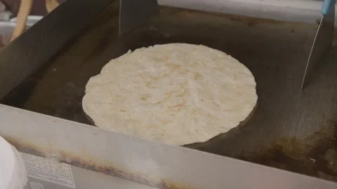 Flatbread Cooking on Griddle at Beijing Street Food Stall, Close Up Stock Footage 345905557