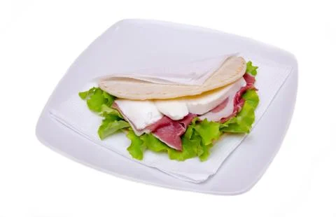 Flatbread with ham and mozzarella cheese on white background Foto stock