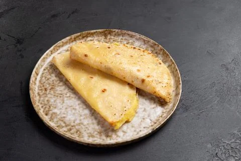 Flatbread with mashed potatoes. castey. On a dark background. Stock Photos