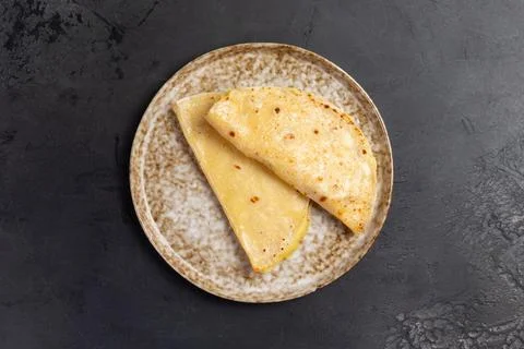 Flatbread with mashed potatoes. castey. On a dark background. Stock Photos