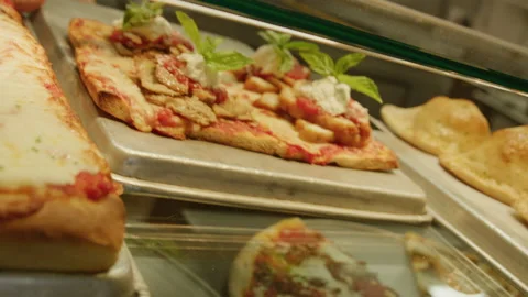 Flatbread pizza slide into glass counter pizza shop italian restaurant medium Stock Footage 238804584