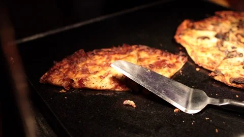 Flatbread pizzas on a warming skillet 스톡 동영상 96177150