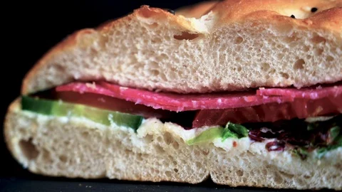 Flatbread sandwich with salami tomato cucumber salad and gravy 2 Stock Footage 120706224