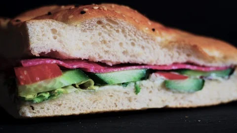 Flatbread sandwich with salami tomato cucumber salad and gravy 4 Stock Footage 120706529