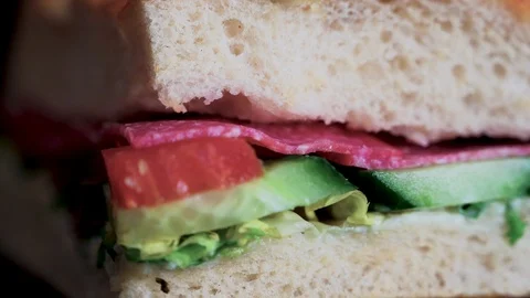 Flatbread sandwich with salami tomato cucumber salad and gravy 5 Stock Footage 120707138
