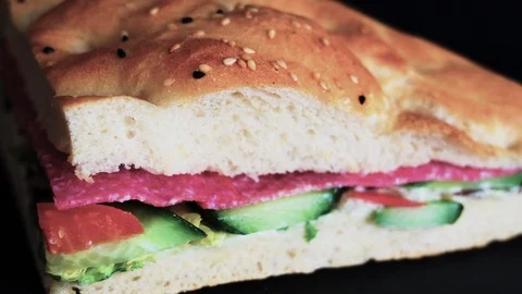 Flatbread sandwich with salami tomato cucumber salad and gravy 6 Stock Footage 120707247