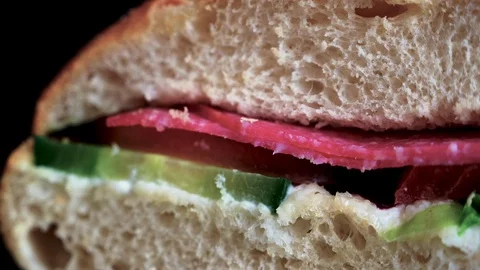 Flatbread sandwich with salami tomato cucumber salad and gravy 3 Stock Footage 120707276