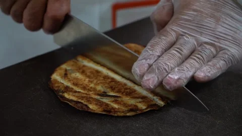 Flatbread Slicing in Kitchen Stock Footage 318310182
