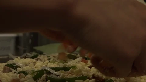 On a flatbread with vegetables from pizza pizzaiolo puts tomatoes. Video stock 126913006