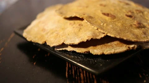 Flatbreads on the black plate Видео 67479358