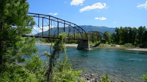 Flathead River Flowing Under Abandoned Bridge in Montana 스톡 동영상 112972629